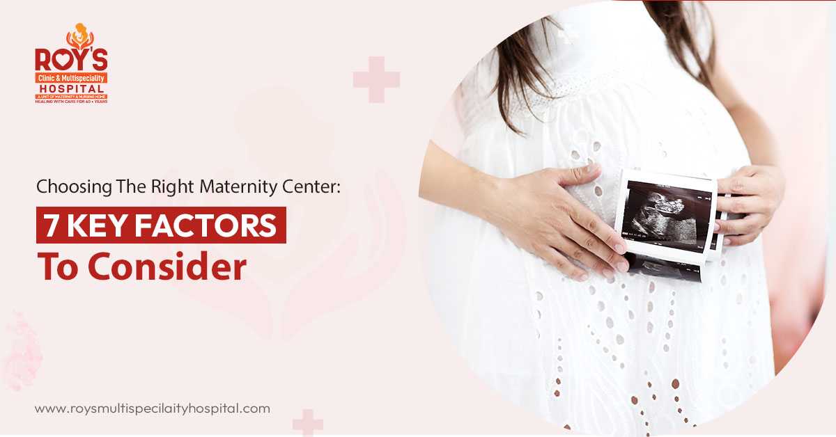 Expectant couple discussing maternity center options - Roy's Clinic & Multispecialty Hospital